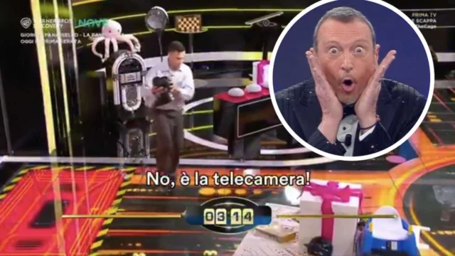 A The Cage concorrente scambia la telecamera per un premio e tenta di portarla via, la reazione di Amadeus