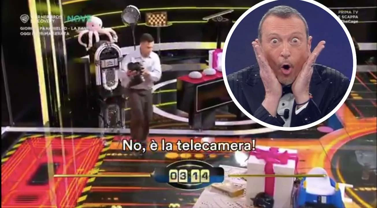 A The Cage concorrente scambia la telecamera per un premio e tenta di portarla via, la reazione di Amadeus