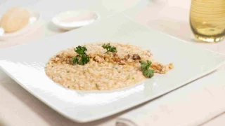 Riso Vialone Nano alla tinca del Signor Bruno, piatto signature del ristorante Riflessi Bardolino.